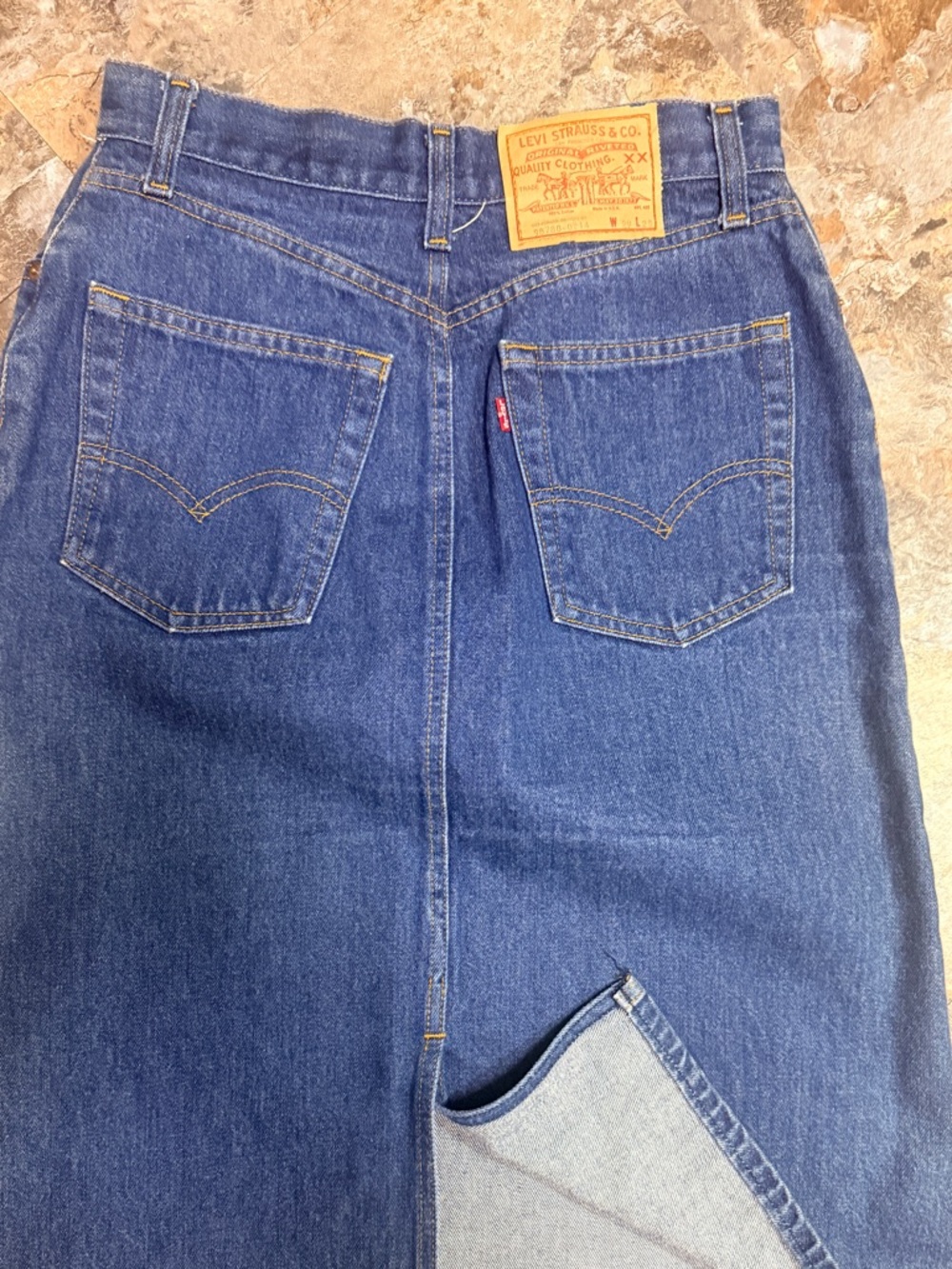 1980’s Levi's Blue Denim Jean skirt with back slit. 
29x25